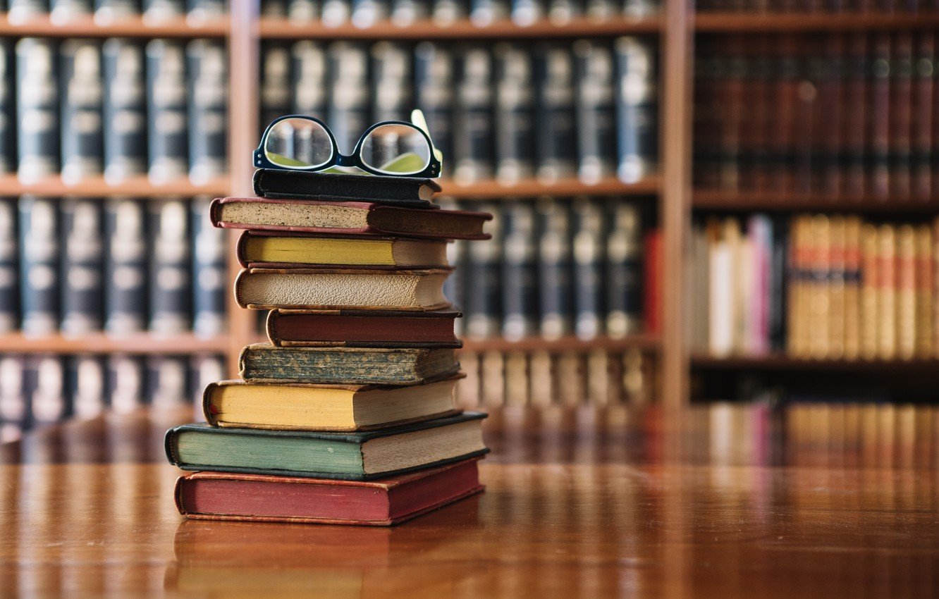 Stack of academic books in a university library