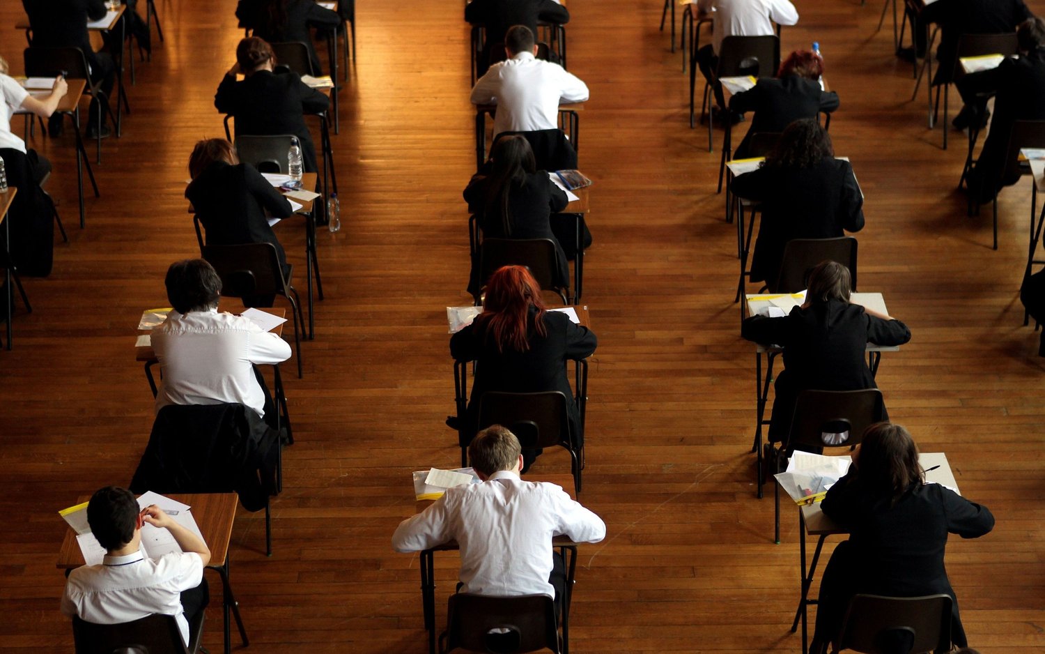 Students sitting examinations in a grand hall